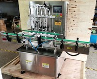Machine de remplissage et de scellage à 6 têtes pour liquides (eau pure, huile d'olive, savon liquide pour les mains, miel) avec pompe magnétique à rotor en plastique, Dubaï