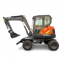 Machinerie de terrassement : Mini-pelle sur roues 6 tonnes DX60W avec tarière, godet à pince, moteur, pompe et engrenages à haute efficacité