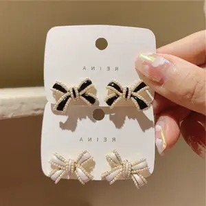 Kaimei Japanese and Korean pearl three-dimensional bowknot cute and playful girl earrings ins niche wild earrings