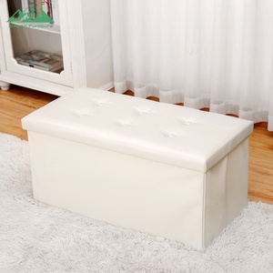 Banc ottoman pliable compact et peu encombrant en cuir noir avec rangement caché - Product Image 1