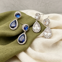 Boucles d'oreilles pendantes double halo en saphir bleu pour mariée, plaqué argent, pavé de CZ étincelant, hypoallergéniques, bijoux de mariage OEM/ODM 2026