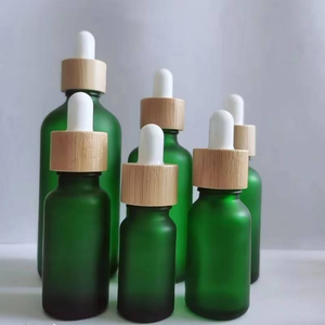 Botella de vidrio de alta calidad con tubo blanco y anillo de bambú/madera; impresión personalizada y serigrafía disponible. - Product Image 6