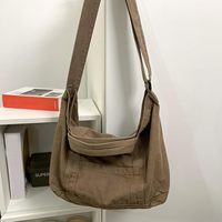 Sac fourre-tout et bandoulière en toile unie tendance pour femme avec fermeture éclair et poches, petite taille pour le travail et la plage