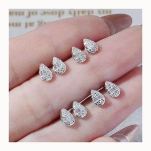 Boucles d'oreilles pendantes Xinfly en or 18 carats avec diamant naturel 0,2 carat, motif trèfle à quatre feuilles - Product Image 1