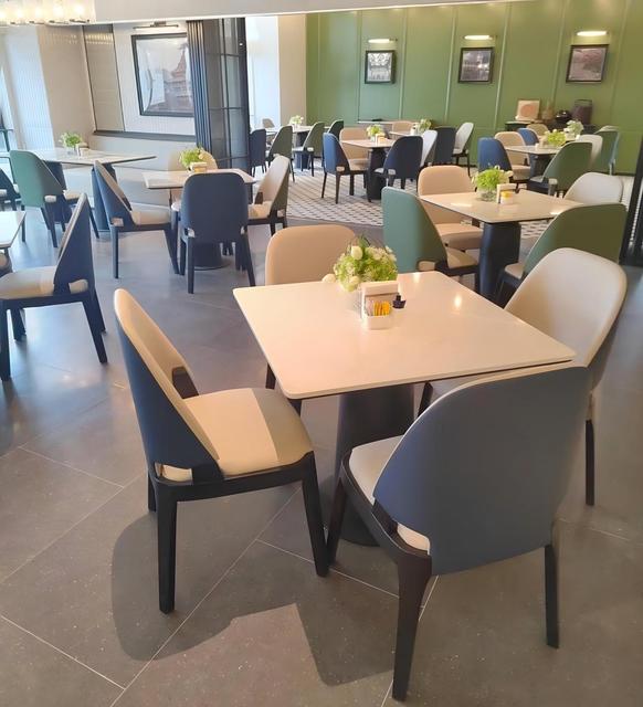 Modern Café & Restaurant Furniture Two-Tone Upholstered Chairs Marble Top Tables & Booth Seating Fresh Color Accents