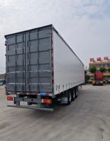 Semi-remorque à plateau en acier à trois essieux avec rideau latéral ouvrant, pour conteneurs de 20/40 pieds, capacité de charge supérieure à 30 000 kg