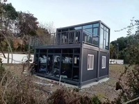 JHCE1 Maison préfabriquée de luxe à deux étages, conteneur modulaire extensible, studio contemporain avec mur en verre, balcon, villa noire