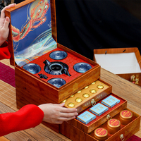 Un coffret cadeau de thé haut de gamme contenant du thé Pu'er, du thé Oolong et du thé noir, adapté pour offrir en cadeau ou pour un plaisir personnel.