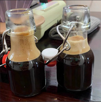 Bouteille en verre vide réutilisable de 60 ml (2 oz) avec bouchon à bascule hermétique, mini bouteille en verre pour boissons, lait, jus, kombucha