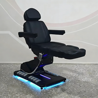 Meubles de salon de beauté modernes entièrement noirs, table de massage à 4 moteurs rotatifs, fauteuil de soin du visage électrique inclinable de luxe, lit de spa