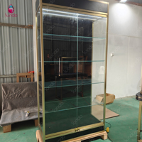 Vitrine murale pour bijoux Sundo, en daim bleu marine, avec socle rond, en bronze noir, pour boutique