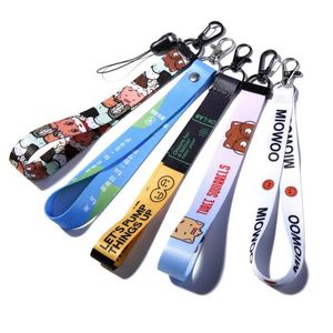 Dragonne de poignet économique, courte, réglable, style anime et dessin animé mignon, avec porte-clés et logo personnalisé - Product Image 1