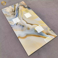 Carrelage de sol en porcelaine marbrée jaune brillant Springletile, carreaux de pierre d'agate veinée or de luxe pour la décoration murale intérieure