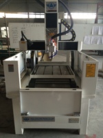 Machine de gravure sur pierre 4 axes JK-6060, modèle populaire, moteur efficace pour artisanat, moteur PLC, moule métallique, structure fermée, haute performance