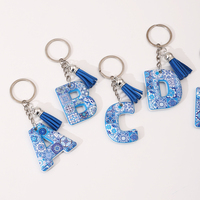 Vente en gros stock de porte-clés en résine alphabet 3D série de carreaux accessoires élégants inspirés du Feng Shui