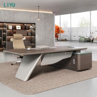 Bureau de direction moderne avec pied trapézoïdal incliné, éclairage LED cyan et armoire latérale pour bureau