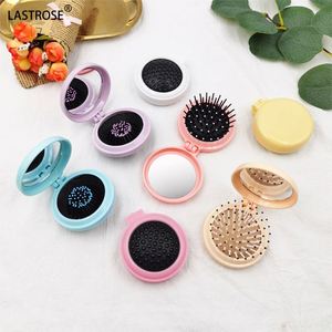 Peigne démêlant massant portable pliable avec finition en alliage de zinc, mini miroir intégré, idéal pour les voyages des enfants - Product Image 1