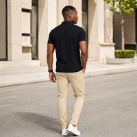 Polo homme noir slim fit à manches courtes avec patte de boutonnage, décontracté, été, urbain, vierge, personnalisable, vente en gros