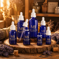 Flacon en verre de luxe bleu cobalt de 15 ml avec protection UV, bouchon à vis, estampage à chaud doré et sérigraphie, idéal pour les parfums