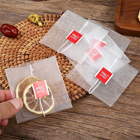 Sachets de thé pyramidaux triangulaires en nylon jetables de qualité alimentaire avec cordon, impression sérigraphique personnalisée du logo