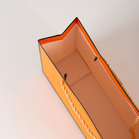 Emballages cadeaux en papier pour petites entreprises, fabricants chinois, avec poignée, sacs de vêtements de luxe personnalisés orange avec logo personnel