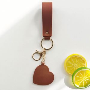 Llavero de Lujo con Logotipo Personalizado, Forma de Corazón, Accesorio para Bolsa, Colgante de Cuero PU con Borla y Espejo - Product Image 3
