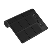 Batterie électronique de table avec 2 haut-parleurs, 9 pads, éclairage coloré, baguettes et pédale.