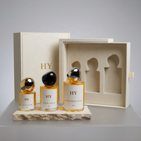Flacon vaporisateur de parfum en verre cylindrique minimaliste 30ml 50ml 100ml personnalisable avec bouchon en forme de pierre