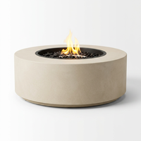 Table de feu ronde Orizaba en béton renforcé de fibres de verre, artisanale, haut de gamme, en acier au carbone sur mesure, pour extérieur, en pierre calcaire.