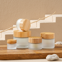 Pot en verre de luxe vide de 30g, 50g, 100g pour masque facial, crème capillaire, avec couvercle en bambou pour emballage de produits de soin de la peau