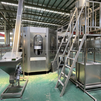 Machine de remplissage de liquides automatique à haute productivité contrôlée par PLC pour bouteilles de boissons en verre et bouteilles de 200 ml, capacité 304SS 15000BPH