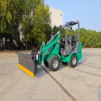 Chargeuse sur pneus articulée compacte avec transmission hydrostatique pour la manutention de matériaux dans les espaces étroits et le déneigement