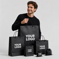 Sacs en papier personnalisés de luxe avec logo pour vêtements, sacs d'emballage rose mat pour boutique de vêtements avec poignées en ruban