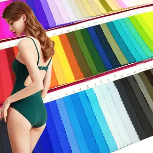 Stock de color de cuatro vías elástico de punto de nylon Spandex color fluorescente tela de traje de baño