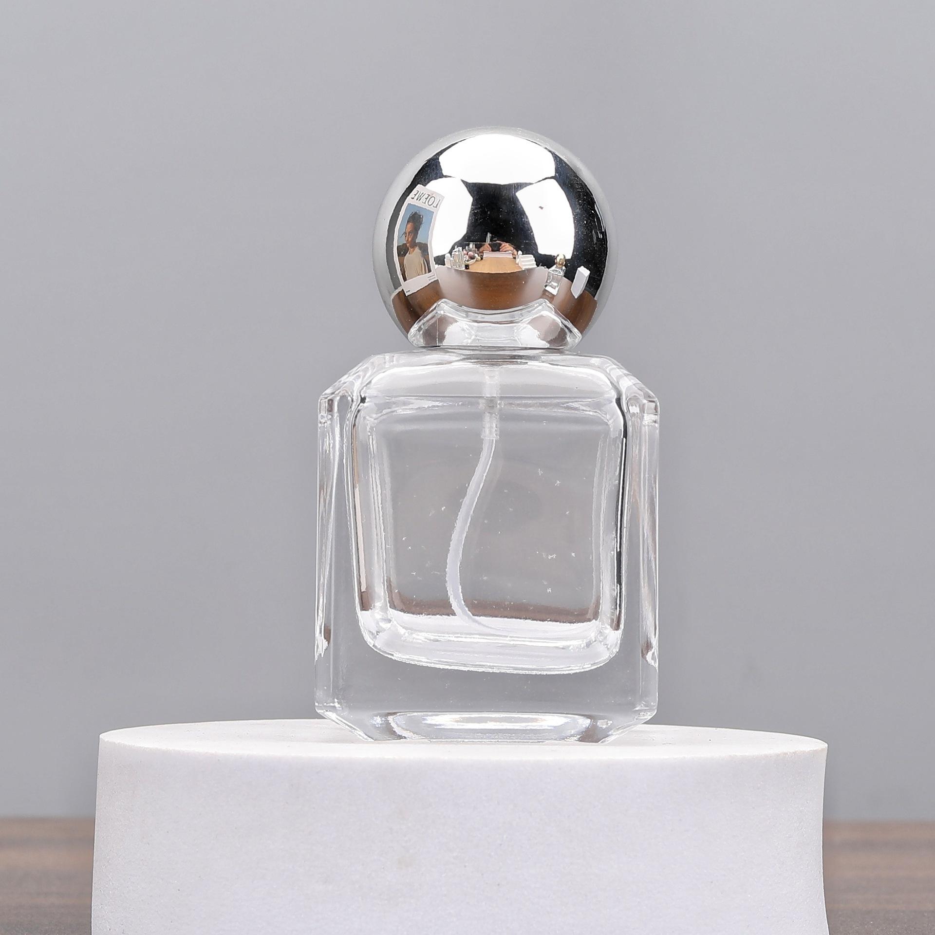 Bouteille transparente-boule dorée brillante