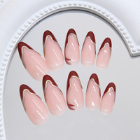 Ongles en amande rouges avec French manucure et contour doré, faux ongles à presser en ABS fabriqués à la machine, lot de 24 ongles en amande avec pointe dorée