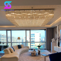 Lustre LED goutte de pluie à haut plafond personnalisé hall d'hôtel de luxe éclairage suspendu en verre moderne base en fer contrôlée à distance