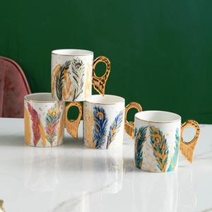 Taza de Cerámica Estilo Europeo con Alas de Ángel Doradas para Desayuno o Té de la Tarde con Plato para Postre - Product Image 2