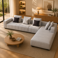 Canapé modulaire en forme de L en tissu gris clair écologique moderne avec chaise longue rembourrée en éponge pour appartement et hôtel