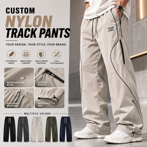 Pantalon de jogging en nylon personnalisé, léger, résistant à l'eau, coupe ample, poche zippée, ourlet ajustable, pour hommes - Product Image 1