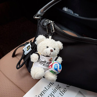 Porte-clés en peluche ours en peluche maillot d'équipe de football, pendentif mini ballon et sac, pour fans de stars de football, vente en gros