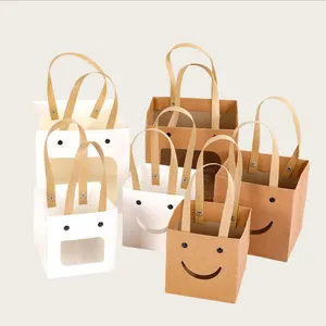 Hete Promotie Eenvoudige Mode Mooie Ecologische Lachende Gezicht Papieren Geschenkzak Vierkante Kraftpapier Cadeau Open Raam Handtas