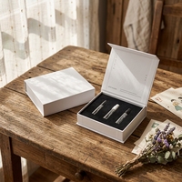 Boîte cadeau en carton écologique avec logo personnalisé pour ensemble de flacons de parfum cosmétique multi-pièces, parfum de découverte de luxe