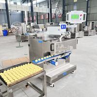 Machine à encruster les mochis, machine industrielle automatique de boulangerie pour l'étirement de la pâte, la fabrication de pain et la production de crème glacée