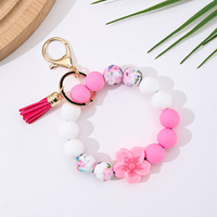 Cenda Fashion Silikon-Perlen-Armband Schlüsselanhänger mit Blumen-Charm Quaste Blumenmuster Perlen Elastisches Armband Schlüsselring für Frauen