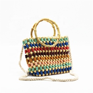 2024 bolso <span class=keywords><strong>de</strong></span> mano multicolor con cuentas multicolor con mango <span class=keywords><strong>de</strong></span> <span class=keywords><strong>madera</strong></span> bolso <span class=keywords><strong>de</strong></span> hombro con cuentas <span class=keywords><strong>de</strong></span> <span class=keywords><strong>ganchillo</strong></span> <span class=keywords><strong>de</strong></span> paja <span class=keywords><strong>para</strong></span> mujer - Product Image 5