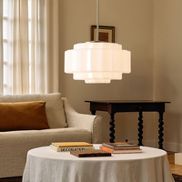 Lampe suspendue Jules en verre laiteux à étages en laiton antique moderne Simig Lighting