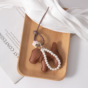 Nouveau porte-clés chien en cuir PU, motif chiot de dessin animé tissé multicolore, avec pendentif sac et décoration chaîne de perles, sérigraphié - Product Image 2