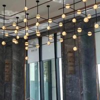 Lustre moderne design en forme de globe en verre pour la décoration intérieure de restaurants et d'hôtels