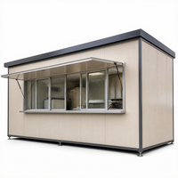 Unité de cuisine mobile préfabriquée avec large façade vitrée pour service de restauration sur chantier